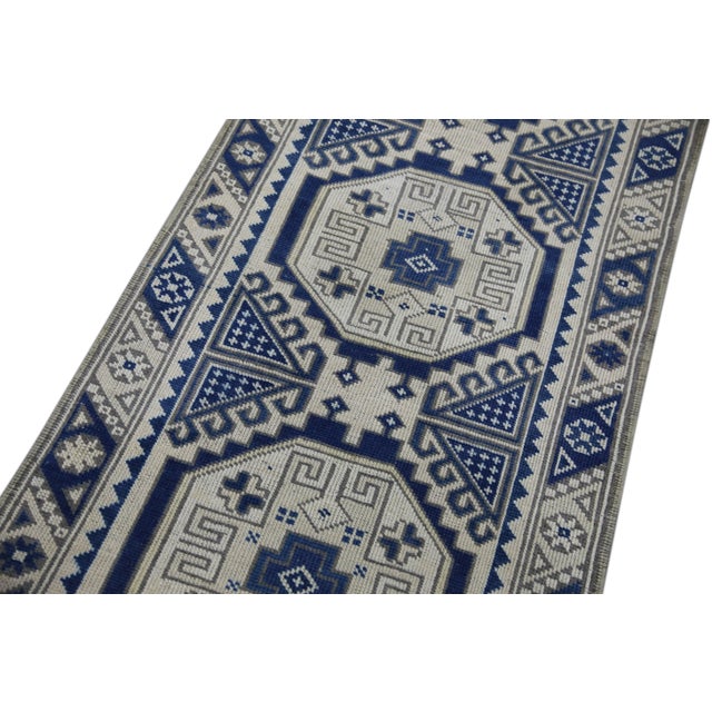 Introducing a one-of-a-kind vintage Turkish hand-knotted wool rug, carefully crafted by skilled artisans using traditional...