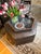 In a pearlized chocolate leather, this piece is an original Donghia ottoman. This piece was purchased directly from the...