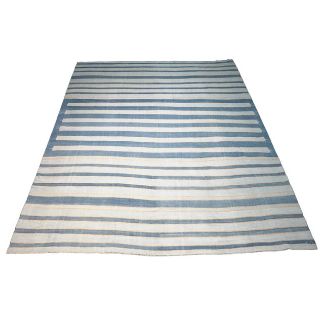 This vintage 10x10 Dhurrie square flat weave is an exciting new entry in Rug & Kilim’s esteemed collection. Handwoven in...