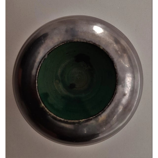 Bead-thick glaze at the lower edge, shining green inside. Archaic reduced form. This piece has an attribution mark, I am...