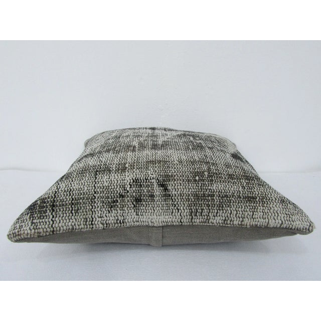 This is a pillow cover made from a vintage kilim rug. The piece was properly washed and ready to use. Pillow inserts not...