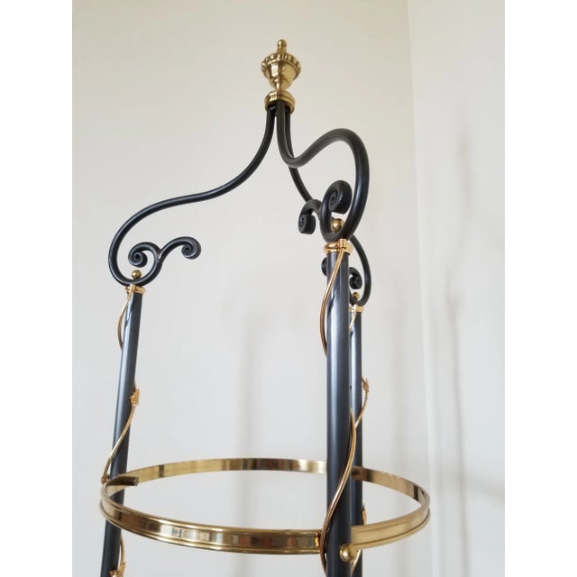 Charming multilevel glass and brass display. Perfect to display a collection of small objects or books.