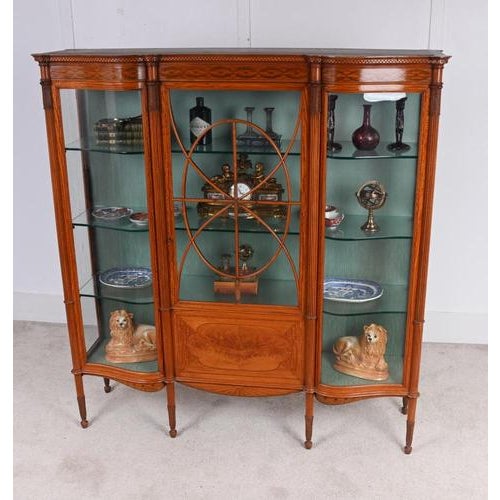 Fine Victorian satinwood inlaid display cabinet dating to circa 1880 Of elegant serpentine breakfront form with a central...