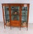Fine Victorian satinwood inlaid display cabinet dating to circa 1880 Of elegant serpentine breakfront form with a central...