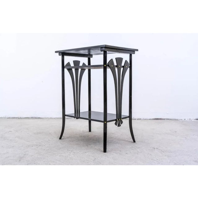 This thonet no. 29 side table is a beautifully restored piece that embodies timeless design with a sleek, updated look....