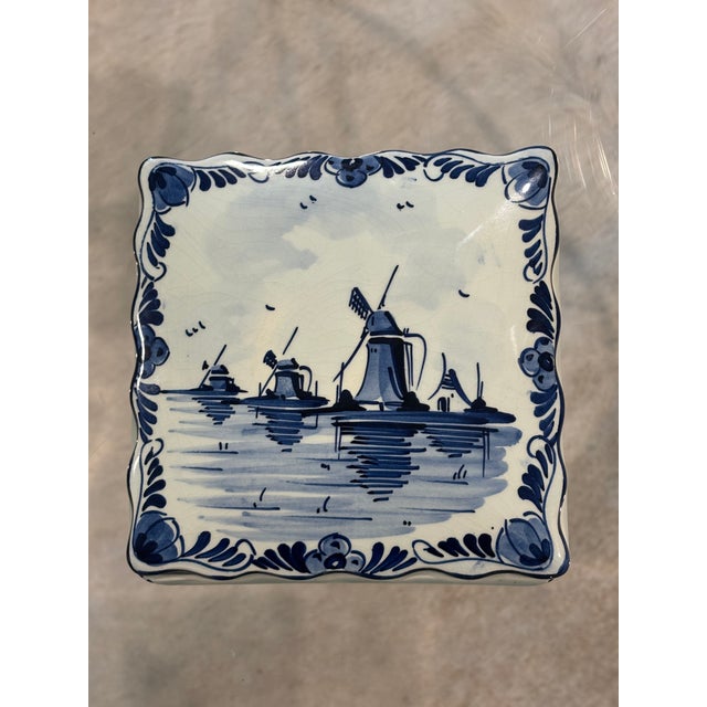 Charming vintage Delft Blue porcelain trinket box, hand painted in Holland with a classic Dutch windmill landscape. CIRCA:...