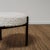 A Danish stool by Hugo Frandsen made from rosewood and reupholstered by The Selby House in a Nobilis Wood Boucle. The...