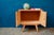 Charming and unique, this small two-door bedside table from the 1950s boasts a slightly rockabilly silhouette! Resting on...