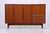 Teak highboard by Heinrich Riestenpatt from the 1960s. The minimalist front with its long handles and finely crafted legs...
