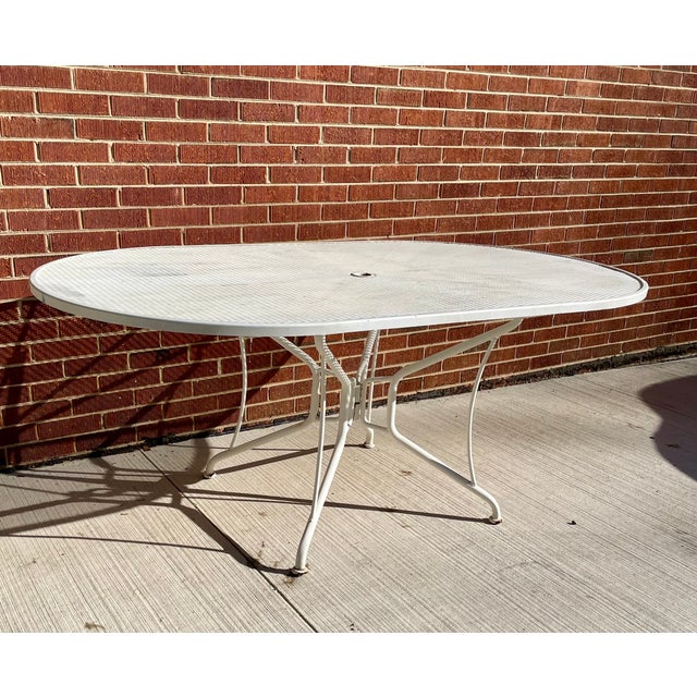 Unmarked by Woodard 72 inch length 42" Width It seats up to 6 people Integrated umbrella hole 8-spoke base design for...