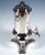 An elegant viennese silver samovar comprising a hot-water vessel with a lockable spout, a warmer and a burner. Cylindrical...