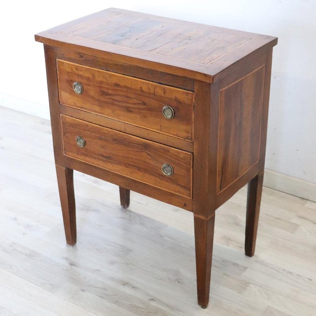 We present this elegant, small antique Italian chest of drawers dating back to the second half of the 18th century, the...
