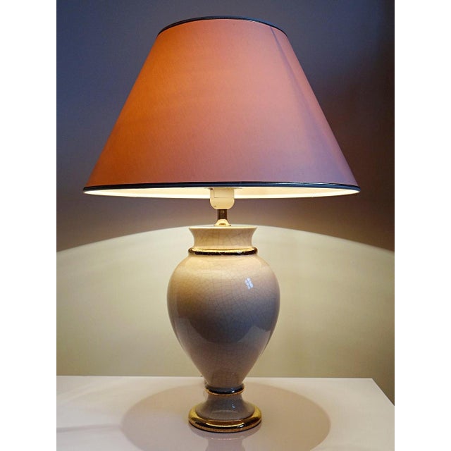 Sold without a lampshade. Ivory crackle-glazed earthenware lamp attributed to Le Dauphin, very similar to the "Panama...