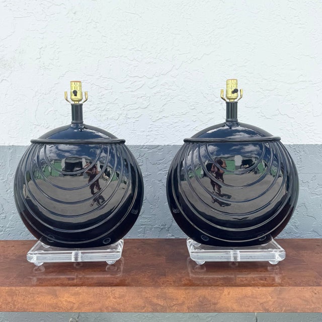A striking blend of sculptural form and high-gloss drama, this pair of postmodern Art Deco–inspired table lamps commands...