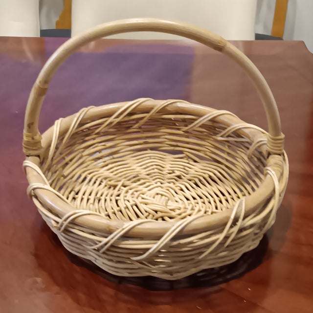 Large French woven wicker basket with Bamboo handle. Natural wicker for a Lovely French Country décor that will add a...