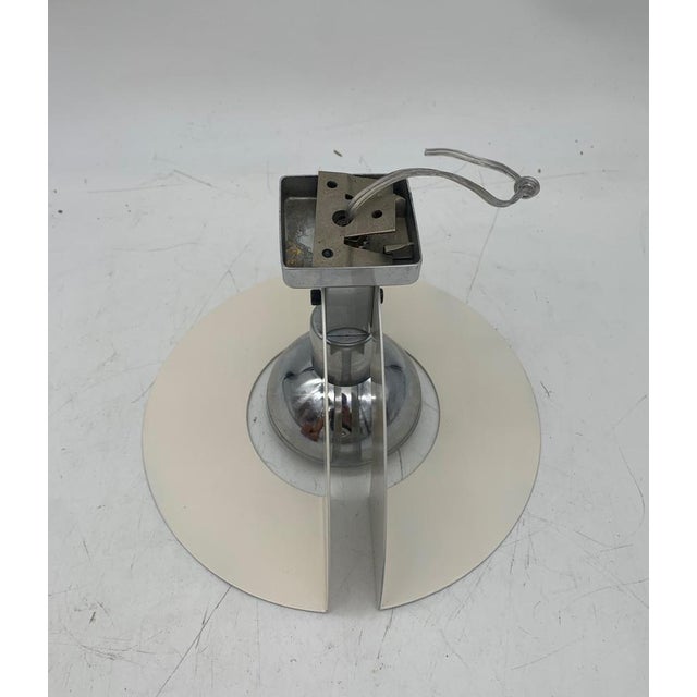 Fantastic pair of designer metal wall lights attributed to Reggiani. Each wall light has an E14 lamp holder. Externally...