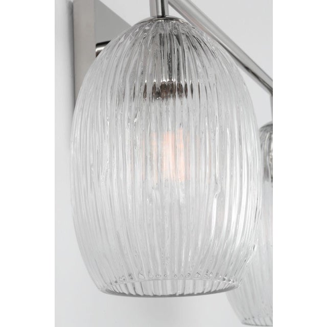 Serafina 16-inch Vanity by Hable offers a sculptural approach to functional lighting, with softly contoured glass pods...