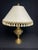 Lovely Chinoiseries Style Brass Table Lamp during the Mid-20th Century. This is a beautiful lamp and come with a custom-...