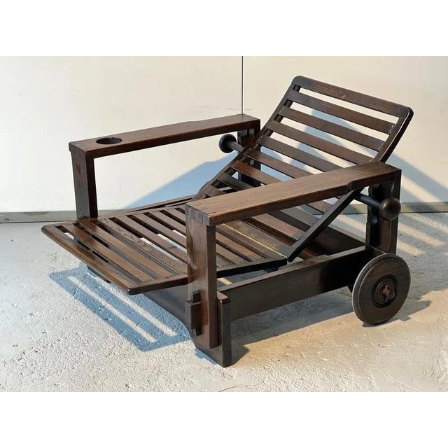 Wooden armchair with its 1965 ottoman attributed to Editions Asko with casters. Beautiful mortise and tenon assembly...