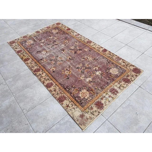 A Turkish handmade vintage Anatolian Oushak rug. We collect old vintage antique rugs from Anatolia, which is the eastern...