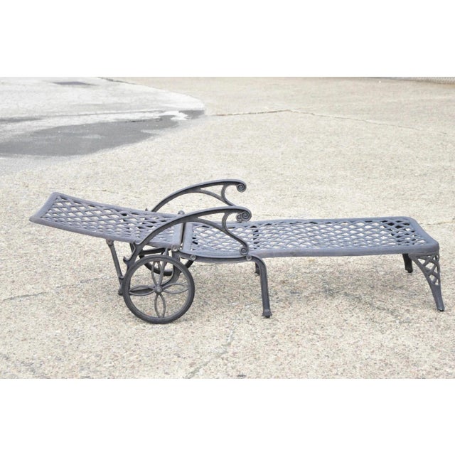 Tuscan Mediterranean Style Black Cast Aluminum Pool Patio Chaise Lounge Chair. Circa Late 20th Century. Measurements: 32"...