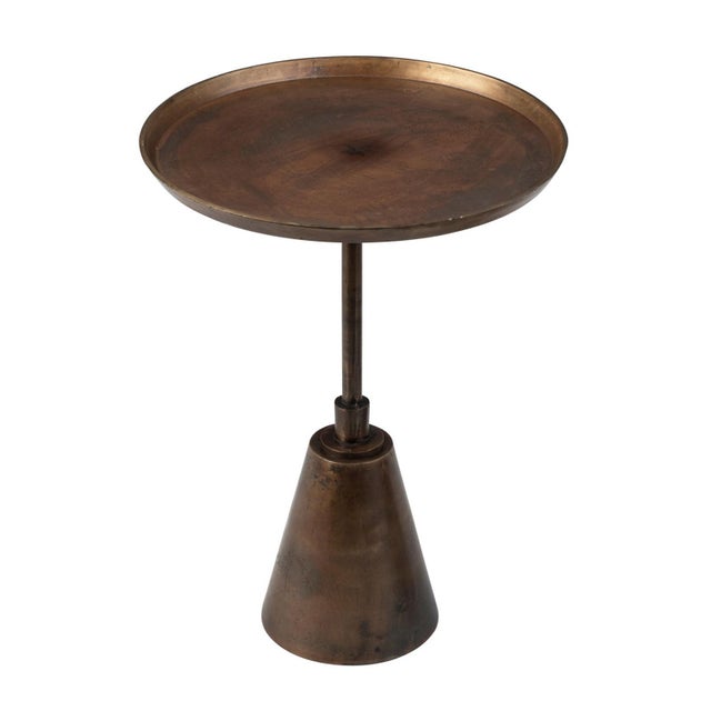 Oiled brass finish aluminum side table. Round tray style top on sleek pedestal base. Each has slight variations in finish...