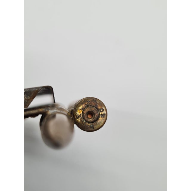 This double photo frame, made using the trench art technique, was created in the early 20th century in the German Empire...