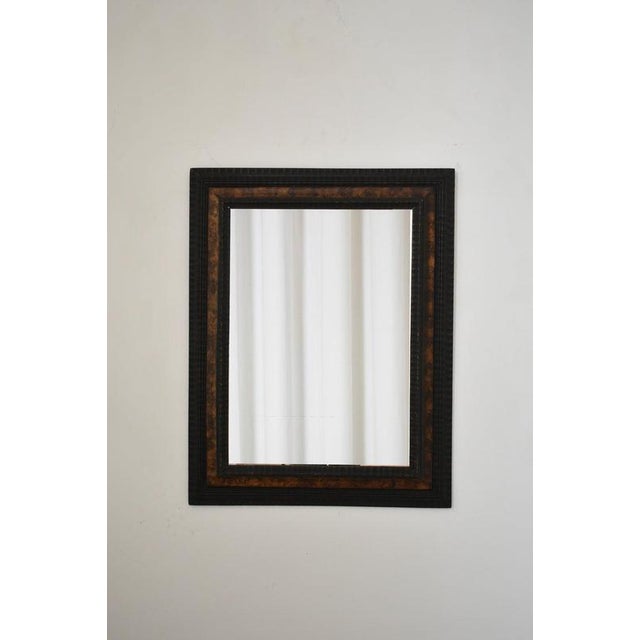 Carved ebonised wood mirror and trompe l'oeil turshell, XIXth c. Height: 93 cm - 36.61 in Length: 72 cm - 28.35 in Width:...