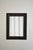 Carved ebonised wood mirror and trompe l'oeil turshell, XIXth c. Height: 93 cm - 36.61 in Length: 72 cm - 28.35 in Width:...