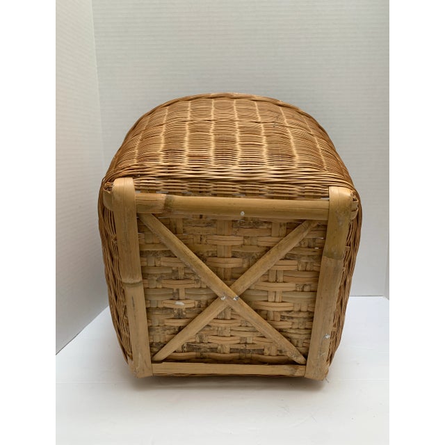 Vintage Asian tan organizational basket or wastebasket with wood base feet.