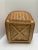 Vintage Asian tan organizational basket or wastebasket with wood base feet.
