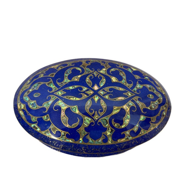 Handcrafted in Egypt, this exquisite oval jewelry box combines genuine Mother of Pearl, natural Lapis Lazuli, and detailed...