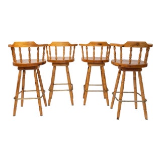 1980s Set of 4 Knotty Pine Swivel Captain’s Bar Stools With Saddle Seats For Sale