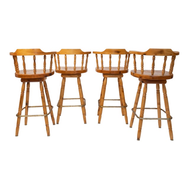 1980s Set of 4 Knotty Pine Swivel Captain’s Bar Stools With Saddle Seats For Sale
