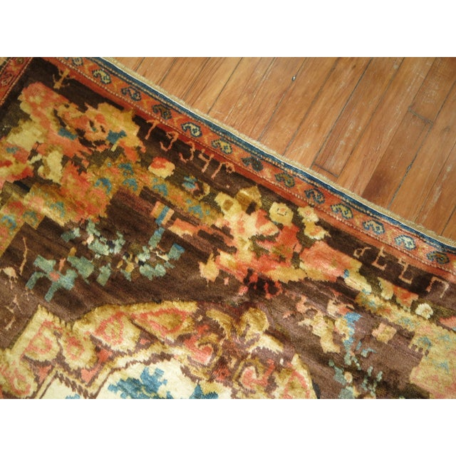 A floral motif karabagh rug dated 1934 signed by weaver. The wool has a silky feel and sheen to it. Predominantly muave,...