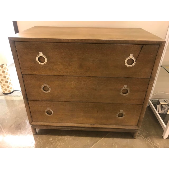Sophisticated in name and in style. This majestic chest is composed of a mid toned wood body that houses three wide and...