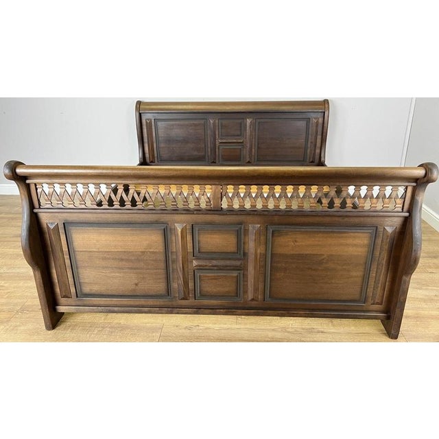 An impressive Vintage French Super King size bed with a substantial sleigh-style profile, decorative panelled detailing...