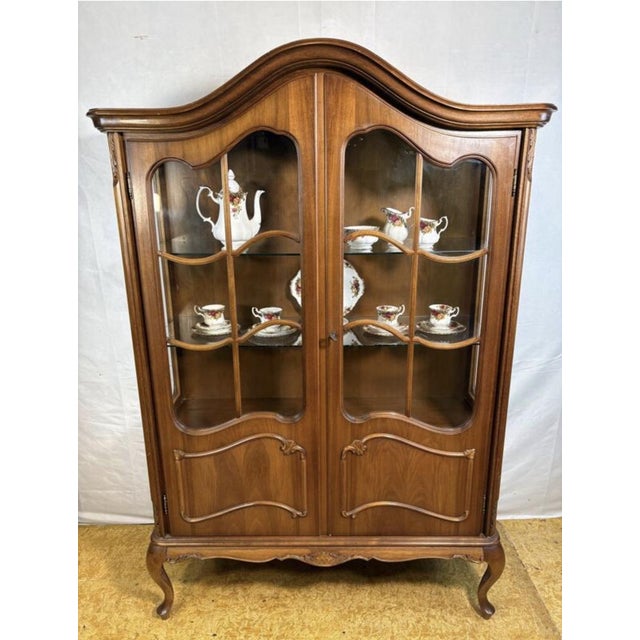 Bring timeless elegance and sophistication to your home with this beautiful baroque-style display cabinet dating from the...