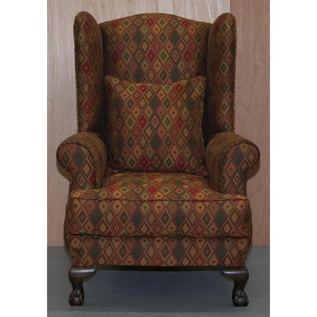 We are delighted to offer for sale this lovely Kilim style upholstery wingback armchair in good vintage condition...