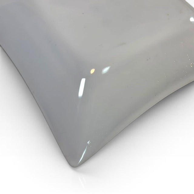 A striking pair of authentic Mid-Century Modern square catchall dishes by iconic American designer Georges Briard....