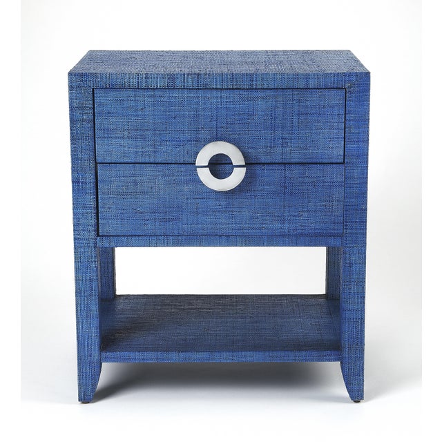 Bring a little of the outdoors in with this raffia-clad nightstand or end table. Providing convenient storage and great...