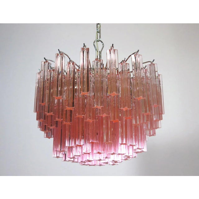 Fantastic vintage murano chandelier made by 107 murano crystal prism quadriedri in a nickel metal frame. The glass has a...