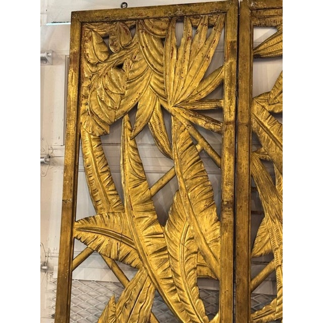 The product is a rare vintage Maison Jansen giltwood screen, adding a touch of elegance and sophistication to any room....