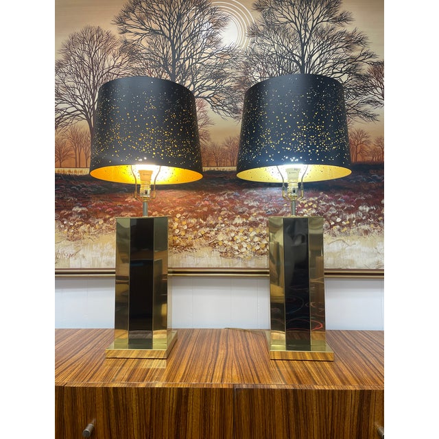 Chic pair of black and gold Pierre Cardin style table lamps. The elegant lamps are unmarked, but look to be Italian made....
