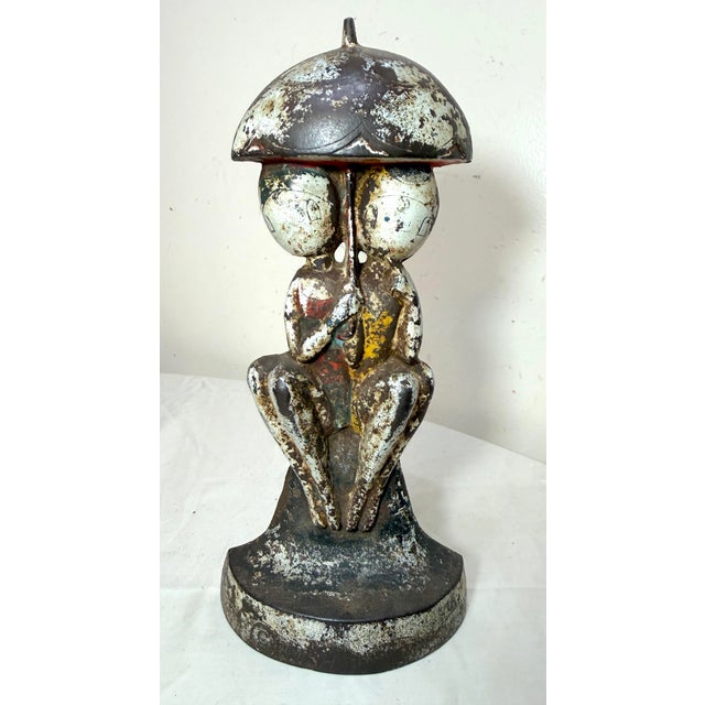 The Antique 1920s Original Hubley "Bathing Beauties" by Anne Fish Doorstop #250 is a collectible door stop made of cast...