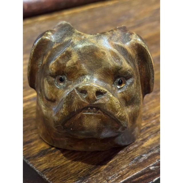 Antique handcarved wooden bull-dog head pipe rest. Has the cutest little teeth and glass eyes! I picked it up in Amsterdam...