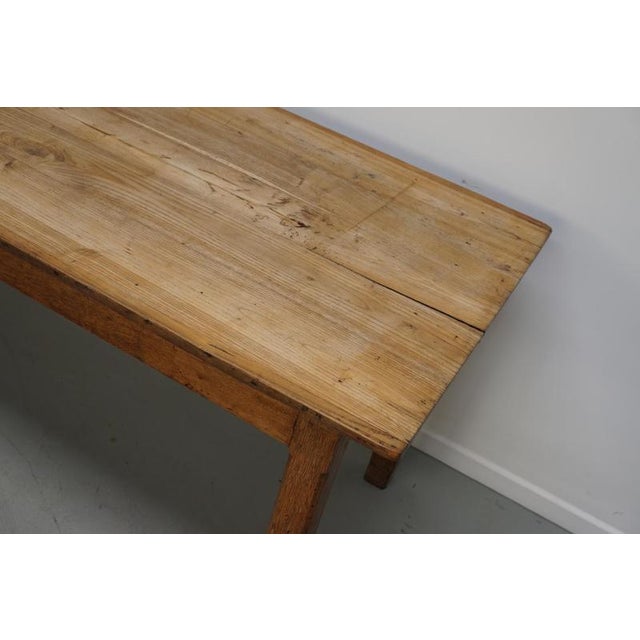 This elegant table was made in Southern France in the early 20th century. The table was made in solid elm with beautiful...