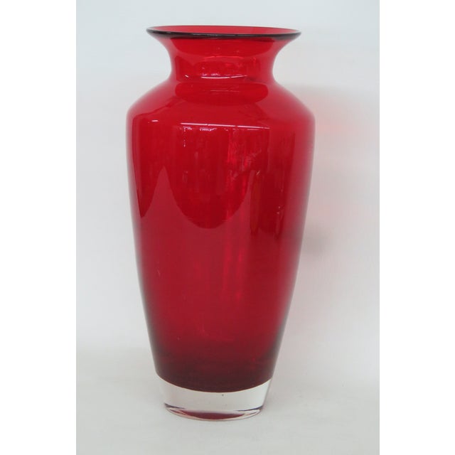 This gorgeous Tall Vase is made of glass. This beautiful vintage vase presents a stunning ruby red color to the glass; it...