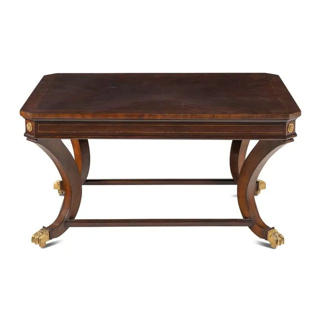 Beautiful Regency style mahogany rectangular table with book-matched veneer top and inlaid accent borders. Curved legs...
