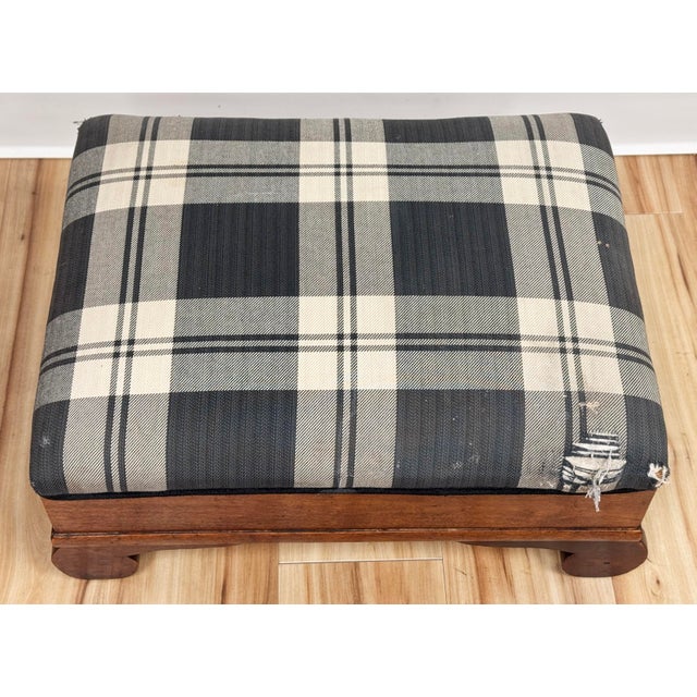 Antique Early American Empire style footstool ottoman featuring original gray and ivory plaid upholstery. Hinged lid for...